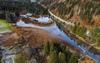 Zelenci wetlands near Kranjska Nora, Slovenia after heavy rainfall on 12th of November 2023. Zelenci are ground source of Sava Dolinka river, where water boils from up to 2 meters deep green lake.