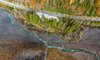 Zelenci wetlands near Kranjska Nora, Slovenia after heavy rainfall on 12th of November 2023. Zelenci are ground source of Sava Dolinka river, where water boils from up to 2 meters deep green lake.