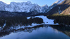 Aerial views to Laghi di Fusine near Tarvisio, Italy, on crispy winter morning of 23rd of December 2023.