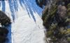 Aerial views to cross country skiing tracks near Ratece, Slovenia, on sunny winter morning of 23rd of December 2023.