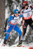 Kaisa Makarainen of Finland skiing behind Germanys Magdalena Neunerduring in women 7.5 km Sprint Biathlon World Cup race in Anterselva, Italy. Sprint race of Women IBU Biathlon World Cup was held in Anterselva, Italy on 17th of January 2008. Kaisa Makarainen placed 24th.
