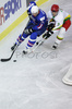 Anze Terlikar (no.24) of Slovenia (L) and Mindaugas Kieras (no.3) of Lithuania (R) during match of IIHF Division 1 World championships between Slovenia and Lithuania. Match was won by Slovenia who defeated Lithuania with 4:2. Match was played in Tivoli Arena in Ljubljana, Slovenia on 21. of April 2007.
