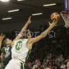 Saulius Kuzminskas (no. 14) of Union Olimpija scroring while Ramunas Siskauskas (no. 9) of Panathinaikos (L) and Robertas  Javtokas (no. 19) of Panathinaikos (M) are trying to hinder him during match of Euroleague League between KK Union Olimpija, Ljubljana, Slovenia and Panathinaikos Athens, Greece. Match ended with victory of Panathinaikos, who defeated Union Olimpija with 86:65. Match between KK Union Olimpija and Panathinaikos was played in Tivoli hall in Ljubljana, Slovenia on 8. November 2006.
