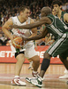Marko Milic (no. 12) of Union Olimpija (L) in offence while Tony Delk (no. 5) of Panathinaikos is trying to hinder him during match of Euroleague League between KK Union Olimpija, Ljubljana, Slovenia and Panathinaikos Athens, Greece. Match ended with victory of Panathinaikos, who defeated Union Olimpija with 86:65. Match between KK Union Olimpija and Panathinaikos was played in Tivoli hall in Ljubljana, Slovenia on 8. November 2006.
