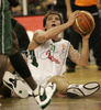 Manuchar Markoishvili (no. 11) of Union Olimpija is fighting for ball even when he is on floor already.Match between Union Olimpija and Panathinaikos Athens ended with victory of Panathinaikos, who defeated Union Olimpija with 86:65. Match between KK Union Olimpija and Panathinaikos was played in Tivoli hall in Ljubljana, Slovenia on 8. November 2006.
