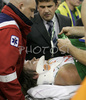Saulius Kuzminskas (no. 14) of Union Olimpija is taken away by paramedics after getting injured during match of 5th round of Basketball Euroleague League between KK Union Olimpija, Ljubljana, Slovenia and Partizan Belgrade, Serbia. Match ended with victory of Partizan, who defeated Union Olimpija with 70:71. Match between KK Union Olimpija and Partizan was played in Tivoli hall in Ljubljana, Slovenia on 22. November 2006.
