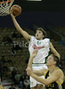 Manuchar Markoishvili (no. 11) of Union Olimpija scoring over Marko Car of Split Osiguranje (R) during match NLB League between KK Union Olimpija, Ljubljana, Slovenia and Split Osiguranje, Croatia. Match ended with victory of Union Olimpija, who defeated Split Osiguranje with 85:71. Match between KK Union Olimpija and Split Osiguranje was played in Tivoli hall in Ljubljana, Slovenia on 25. November 2006.

