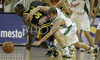 Teemu Rannikko (no. 9) of Union Olimpija (R) and Curtis Stinson of Split Osiguranje (L) fighting for ball during match NLB League between KK Union Olimpija, Ljubljana, Slovenia and Split Osiguranje, Croatia. Match ended with victory of Union Olimpija, who defeated Split Osiguranje with 85:71. Match between KK Union Olimpija and Split Osiguranje was played in Tivoli hall in Ljubljana, Slovenia on 25. November 2006.
