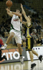Manuchar Markoishvili (no. 11) of Union Olimpija going to score during match NLB League between KK Union Olimpija, Ljubljana, Slovenia and Split Osiguranje, Croatia. Match ended with victory of Union Olimpija, who defeated Split Osiguranje with 85:71. Match between KK Union Olimpija and Split Osiguranje was played in Tivoli hall in Ljubljana, Slovenia on 25. November 2006.

