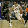 Domen Lorbek (no. 23) of Union Olimpija (R) and James Elmer Bennet (no.6) of DKV Joventut (L) during match of 7th round of Basketball Euroleague League between KK Union Olimpija, Ljubljana, Slovenia and DKV Joventut, Badalona, Spain . Match ended with victory of DKV Joventut, who defeated Union Olimpija with 67:69. Match between KK Union Olimpija and DKV Joventut was played in Tivoli Arena in Ljubljana, Slovenia on 7. December 2006.
