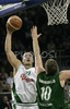 Marko Milic (no. 12) of Union Olimpija (L) scoring over Robert Archibald (no.10) of DKV Joventut (R) during match of 7th round of Basketball Euroleague League between KK Union Olimpija, Ljubljana, Slovenia and DKV Joventut, Badalona, Spain . Match ended with victory of DKV Joventut, who defeated Union Olimpija with 67:69. Match between KK Union Olimpija and DKV Joventut was played in Tivoli Arena in Ljubljana, Slovenia on 7. December 2006.
