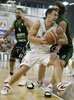 Marko Milic (no. 12) of Union Olimpija (front) attacking while Dimitri Flis (no.20) of DKV Joventut (back) trying to block him during match of 7th round of Basketball Euroleague League between KK Union Olimpija, Ljubljana, Slovenia and DKV Joventut, Badalona, Spain . Match ended with victory of DKV Joventut, who defeated Union Olimpija with 67:69. Match between KK Union Olimpija and DKV Joventut was played in Tivoli Arena in Ljubljana, Slovenia on 7. December 2006.
