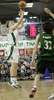 Teemu Rannikko (no. 9) of Union Olimpija (L) throwing for 3 points while Ricard Rubio (no.32) of DKV Joventut (R) is trying to block him, during match of 7th round of Basketball Euroleague League between KK Union Olimpija, Ljubljana, Slovenia and DKV Joventut, Badalona, Spain . Match ended with victory of DKV Joventut, who defeated Union Olimpija with 67:69. Match between KK Union Olimpija and DKV Joventut was played in Tivoli Arena in Ljubljana, Slovenia on 7. December 2006.
