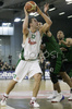 Marko Milic (no. 12) of Union Olimpija (L) trying to score while Charles Gaines (no.41) of DKV Joventut (R) is trying to block him during match of 7th round of Basketball Euroleague League between KK Union Olimpija, Ljubljana, Slovenia and DKV Joventut, Badalona, Spain . Match ended with victory of DKV Joventut, who defeated Union Olimpija with 67:69. Match between KK Union Olimpija and DKV Joventut was played in Tivoli Arena in Ljubljana, Slovenia on 7. December 2006.
