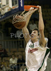 Kamil Pietras (no. 54) of Union Olimpija in one of his dunks during match of NLB League between Union Olimpija, Ljubljana, Slovenia and KK Zagreb, Croatia. Match ended with victory of Union Olimpija, who defeated Zagreb with 87:76. Match between KK Union Olimpija and Zagreb was played in Tivoli Arena in Ljubljana, Slovenia on 9. December 2006.
