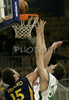 Kamil Pietras (no. 54) of Union Olimpija (R) jumping for ball with Denis Vrsaljko (no.15) of Zagreb (L) of Zagreb during match of NLB League between Union Olimpija, Ljubljana, Slovenia and KK Zagreb, Croatia. Match ended with victory of Union Olimpija, who defeated Zagreb with 87:76. Match between KK Union Olimpija and Zagreb was played in Tivoli Arena in Ljubljana, Slovenia on 9. December 2006.
