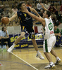 Gordan Zadravec (no.9) of Zagreb (L) attacking while Marko Milic (no. 12) of Union Olimpija (R) is covering him during match of NLB League between Union Olimpija, Ljubljana, Slovenia and KK Zagreb, Croatia. Match ended with victory of Union Olimpija, who defeated Zagreb with 87:76. Match between KK Union Olimpija and Zagreb was played in Tivoli Arena in Ljubljana, Slovenia on 9. December 2006.
