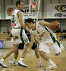Ender Arslan (no. 4) of Union Olimpija (R) attacking while Ivica Jurkovic (no. 13) of Union Olimpija (L) blocked Gordan Zadravec (no.9) of Zagreb (M) during match of NLB League between Union Olimpija, Ljubljana, Slovenia and KK Zagreb, Croatia. Match ended with victory of Union Olimpija, who defeated Zagreb with 87:76. Match between KK Union Olimpija and Zagreb was played in Tivoli Arena in Ljubljana, Slovenia on 9. December 2006.
