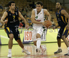 Ender Arslan (no. 4) of Union Olimpija (M) going to score after he passed Krunoslav Simon (no.7) of Zagreb (L) and Dwayne Anthony Broyles (no.5) of Zagreb (R) during match of NLB League between Union Olimpija, Ljubljana, Slovenia and KK Zagreb, Croatia. Match ended with victory of Union Olimpija, who defeated Zagreb with 87:76. Match between KK Union Olimpija and Zagreb was played in Tivoli Arena in Ljubljana, Slovenia on 9. December 2006.
