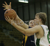 Teemu Rannikko (no. 9) of Union Olimpija (front) scoring while Aleksej Nesovic (no.16) of Zagreb (back) is trying to block him during match of NLB League between Union Olimpija, Ljubljana, Slovenia and KK Zagreb, Croatia. Match ended with victory of Union Olimpija, who defeated Zagreb with 87:76. Match between KK Union Olimpija and Zagreb was played in Tivoli Arena in Ljubljana, Slovenia on 9. December 2006.

