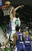 Marko Milic (no. 12) of Union Olimpija jumping for ball during match of 8th round of Basketball Euroleague League between KK Union Olimpija, Ljubljana, Slovenia and Cibona Zagreb, Croatia . Match ended with victory of Union Olimpija, who defeated Cibona with 92:88. Match between Union Olimpija and Cibona was played in Tivoli Arena in Ljubljana, Slovenia on 14. December 2006.
