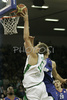 Saulius Kuzminskas (no. 14) of Union Olimpija (L) and Luksa Andric (no.8) of Cibona (R) jumping for ball during match of 8th round of Basketball Euroleague League between KK Union Olimpija, Ljubljana, Slovenia and Cibona Zagreb, Croatia . Match ended with victory of Union Olimpija, who defeated Cibona with 92:88. Match between Union Olimpija and Cibona was played in Tivoli Arena in Ljubljana, Slovenia on 14. December 2006.
