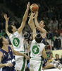 Marton Bader (no.14) of Cibona (M) scoring over Hasan Rizvic (no. 8) of Union Olimpija (L) and Ender Arslan (no. 4) of Union Olimpija (R) during match of 8th round of Basketball Euroleague League between KK Union Olimpija, Ljubljana, Slovenia and Cibona Zagreb, Croatia . Match ended with victory of Union Olimpija, who defeated Cibona with 92:88. Match between Union Olimpija and Cibona was played in Tivoli Arena in Ljubljana, Slovenia on 14. December 2006.
