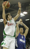 Manuchar Markoishvili (no. 11) of Union Olimpija (L) scoring over Davor Kus (no.5) of Cibona (R) during match of 8th round of Basketball Euroleague League between KK Union Olimpija, Ljubljana, Slovenia and Cibona Zagreb, Croatia . Match ended with victory of Union Olimpija, who defeated Cibona with 92:88. Match between Union Olimpija and Cibona was played in Tivoli Arena in Ljubljana, Slovenia on 14. December 2006.
