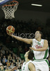 Marko Milic (no. 12) of Union Olimpija scoring over during match of 11th round of Basketball Euroleague League between KK Union Olimpija, Ljubljana, Slovenia and Unicaja, Malaga, Spain. Match ended with victory of Union Olimpija, who defeated Unicaja with 87:59. Match between KK Union Olimpija and Unicaja was played in Tivoli Arena in Ljubljana, Slovenia on 10. January 2007.
