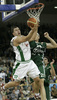 Marko Milic (no. 12) of Union Olimpija (L) scoring over Daniel Santiago (no.25) of Unicaja (R) during match of 11th round of Basketball Euroleague League between KK Union Olimpija, Ljubljana, Slovenia and Unicaja, Malaga, Spain. Match ended with victory of Union Olimpija, who defeated Unicaja with 87:59. Match between KK Union Olimpija and Unicaja was played in Tivoli Arena in Ljubljana, Slovenia on 10. January 2007.
