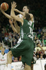 Marko Milic (no. 12) of Union Olimpija (back) scoring over Ignacio De Miguel (no.15) of Unicaja (front) during match of 11th round of Basketball Euroleague League between KK Union Olimpija, Ljubljana, Slovenia and Unicaja, Malaga, Spain. Match ended with victory of Union Olimpija, who defeated Unicaja with 87:59. Match between KK Union Olimpija and Unicaja was played in Tivoli Arena in Ljubljana, Slovenia on 10. January 2007.

