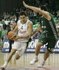Ender Arslan (no. 4) of Union Olimpija (L) and Carlos Cabezas (no.10) of Unicaja (R) during match of 11th round of Basketball Euroleague League between KK Union Olimpija, Ljubljana, Slovenia and Unicaja, Malaga, Spain. Match ended with victory of Union Olimpija, who defeated Unicaja with 87:59. Match between KK Union Olimpija and Unicaja was played in Tivoli Arena in Ljubljana, Slovenia on 10. January 2007.
