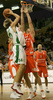 Saulius Kuzminskas (no. 14) of Union Olimpija (L) and Velimir Radinovic (no. 13) of Hemofarm (R) during match of NLB League between KK Union Olimpija, Ljubljana, Slovenia and KK Hemofarm, Vrsac, Serbia. Match ended with victory of Hemofarm, who defeated Union Olimpija with 68:73. Match between KK Union Olimpija and KK Hemofarm was played in Tivoli hall in Ljubljana, Slovenia on 21. October 2006.
