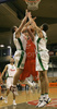 Marko Milic (no. 12) of Union Olimpija (L) and Saulius Kuzminskas (no. 14) of Union Olimpija (R) trying to prevent Vladan Vukosavljevic (no. 51) of Hemofarm (M) from scoring during match of NLB League between KK Union Olimpija, Ljubljana, Slovenia and KK Hemofarm, Vrsac, Serbia. Match ended with victory of Hemofarm, who defeated Union Olimpija with 68:73. Match between KK Union Olimpija and KK Hemofarm was played in Tivoli hall in Ljubljana, Slovenia on 21. October 2006.
