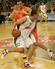 Marko Milic (no. 12) of Union Olimpija (L) attacking during match of NLB League between KK Union Olimpija, Ljubljana, Slovenia and KK Hemofarm, Vrsac, Serbia. Match ended with victory of Hemofarm, who defeated Union Olimpija with 68:73. Match between KK Union Olimpija and KK Hemofarm was played in Tivoli hall in Ljubljana, Slovenia on 21. October 2006.
