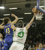 Goran Jurak (no. ) of Union Olimpija scoring while Simas Jasaitis (no.13) of Maccabi Elite (L) was unsuccessfully trying to block him during match of 13th round of Basketball Euroleague League between KK Union Olimpija, Ljubljana, Slovenia and Maccabi Elite, Tel Aviv, Israel. Match ended with victory of Union Olimpija, who defeated Maccabi Elite with 77:75. Match between KK Union Olimpija and Maccabi Elite was played in Tivoli Arena in Ljubljana, Slovenia on 25. January 2007.
