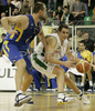Domen Lorbek (no.23) of Union Olimpija (R) while Slavko Duscak (no. ) of Union Olimpija (L) was trying to block him during match of 13th round of Basketball Euroleague League between KK Union Olimpija, Ljubljana, Slovenia and Maccabi Elite, Tel Aviv, Israel. Match ended with victory of Union Olimpija, who defeated Maccabi Elite with 77:75. Match between KK Union Olimpija and Maccabi Elite was played in Tivoli Arena in Ljubljana, Slovenia on 25. January 2007.
