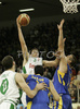 Domen Lorbek (no.23) of Union Olimpija (M) scoring over Nikola Vujcic (no.7) of Maccabi Elite (R) and Sharon Shason (no.11) of Maccabi Elite (L) during match of 13th round of Basketball Euroleague League between KK Union Olimpija, Ljubljana, Slovenia and Maccabi Elite, Tel Aviv, Israel. Match ended with victory of Union Olimpija, who defeated Maccabi Elite with 77:75. Match between KK Union Olimpija and Maccabi Elite was played in Tivoli Arena in Ljubljana, Slovenia on 25. January 2007.

