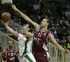 Goran Jurak (no.4) of Union Olimpija (L) scoring while Emir Zimic (no.11) of KK Bosna is trying to block him from behind during NLB league match of 21. round between KK Union Olimpija, Ljubljana, Slovenia and KK Bosna Asa BH Telecom, Sarajevo, Bosnia and Hercegovina. Match ended with victory of Union Olimpija, who defeated KK Bosna ASA BTH with 93:68. Match between KK Union Olimpija and KK Bosna Asa BHT was played in Tivoli Arena in Ljubljana, Slovenia on 17. February 2007.

