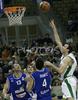 Ivica Jurkovic (no. 13) of Union Olimpija (R) shooting over Sasa Doncic (no.4) of Helios Domzale (M) and Domen Zerak (no.13) of Helios Domzale (L) during match of 22nd round of Basketball NLB League between KK Union Olimpija, Ljubljana, Slovenia and Helios Domzale, Slovenia. Match ended with victory of Helios Domzale, who defeated Union Olimpija with 64:59. Match between KK Union Olimpija and Helios Domzale was played in Tivoli Arena in Ljubljana, Slovenia on 25. January 2007.
