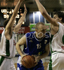 Aleksej Laskevic (no.15) of Helios Domzale (M) surrounded by Manuchar Markoishvili (no. 11) of Union Olimpija (L) and Goran Juran (no.4) of Union Olimpija (R) during match of 22nd round of Basketball NLB League between KK Union Olimpija, Ljubljana, Slovenia and Helios Domzale, Slovenia. Match ended with victory of Helios Domzale, who defeated Union Olimpija with 64:59. Match between KK Union Olimpija and Helios Domzale was played in Tivoli Arena in Ljubljana, Slovenia on 25. January 2007.
