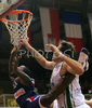 Florent Pietrus (no.11) of France (L) trying to score, while Matjaz Smodis (no.9) of Slovenia (R) is trying to block him from behind during friendly match between Slovenia and France. Match ended with victory of France, who defeated Slovenia with 87:90. Match between Slovenia and France was played in Tabor Arena in Maribor, Slovenia on 25. August 2007.
