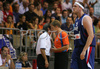 Referee in discussion with French coach Claude Bergeaud  after technical fault of Frederic Weis (no.15) of France (front) during friendly match between Slovenia and France. Match ended with victory of France, who defeated Slovenia with 87:90. Match between Slovenia and France was played in Tabor Arena in Maribor, Slovenia on 25. August 2007.
