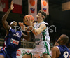 Goran Dragic (no.7) of Slovenia (M) scoring over Tariq Kirksay (no.12) of France (L) and Tony Parker (no.9) of France (R) during friendly match between Slovenia and France. Match ended with victory of France, who defeated Slovenia with 87:90. Match between Slovenia and France was played in Tabor Arena in Maribor, Slovenia on 25. August 2007.
