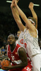 Marc Jackson (no.25) of Olympiacos (L) trying to score next to Miha Zupan (no.24) of Union Olimpija (R)and Sasa Doncic (no.4) of Union Olimpija (M) during match of 2nd round of Basketball Euroleague between Union Olimpija, Ljubljana, Slovenia and Olympiacos, Piraeus, Greece. Match ended with victory of Union Olimpija, who defeated Olympiacos with 87:78. Match between KK Union Olimpija and Olympiacos was played in Tivoli Arena in Ljubljana, Slovenia on 1. November 2007.
