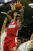 Marc Jackson (no.25) of Olympiacos (M) trying to score next to Miha Zupan (no.24) of Union Olimpija (R)and Sasa Doncic (no.4) of Union Olimpija (L) during match of 2nd round of Basketball Euroleague between Union Olimpija, Ljubljana, Slovenia and Olympiacos, Piraeus, Greece. Match ended with victory of Union Olimpija, who defeated Olympiacos with 87:78. Match between KK Union Olimpija and Olympiacos was played in Tivoli Arena in Ljubljana, Slovenia on 1. November 2007.
