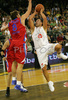Marko Milic (no.12) of Union Olimpija (R) shooting over Matjaz Smodis (no.8) of CSKA Moscow (L) during match of 3nd round of Basketball Euroleague between Union Olimpija, Ljubljana, Slovenia and CSKA Moscow, Russia. Match ended with victory of Union Olimpija, who defeated CSKA Moscow with 74:72. Match between KK Union Olimpija and CSKA was played in Tivoli Arena in Ljubljana, Slovenia on 7. November 2007.
