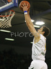 Goran Dragic (no.9) of Union Olimpija scoring during match of 7th round of Basketball Euroleague between Union Olimpija, Ljubljana, Slovenia and Prokom Trefl Sopot, Sopot, Poland. Match ended with victory of Union Olimpija, who defeated Prokom Trefl with 68:49. Match between KK Union Olimpija and Prokom Trefl was played in Tivoli Arena in Ljubljana, Slovenia on 6. December 2007.
