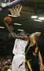 Chris Booker (no.6) of Union Olimpija (L) scoring over Krzysztof Roszyk (no.5) of Prokom Trefl (R) during match of 7th round of Basketball Euroleague between Union Olimpija, Ljubljana, Slovenia and Prokom Trefl Sopot, Sopot, Poland. Match ended with victory of Union Olimpija, who defeated Prokom Trefl with 68:49. Match between KK Union Olimpija and Prokom Trefl was played in Tivoli Arena in Ljubljana, Slovenia on 6. December 2007.
