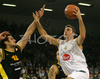 Sasa Doncic (no.4) of Union Olimpija (R) scoring over Jovo Stanojevic (no.12) of Prokom Trefl (L) during match of 7th round of Basketball Euroleague between Union Olimpija, Ljubljana, Slovenia and Prokom Trefl Sopot, Sopot, Poland. Match ended with victory of Union Olimpija, who defeated Prokom Trefl with 68:49. Match between KK Union Olimpija and Prokom Trefl was played in Tivoli Arena in Ljubljana, Slovenia on 6. December 2007.
